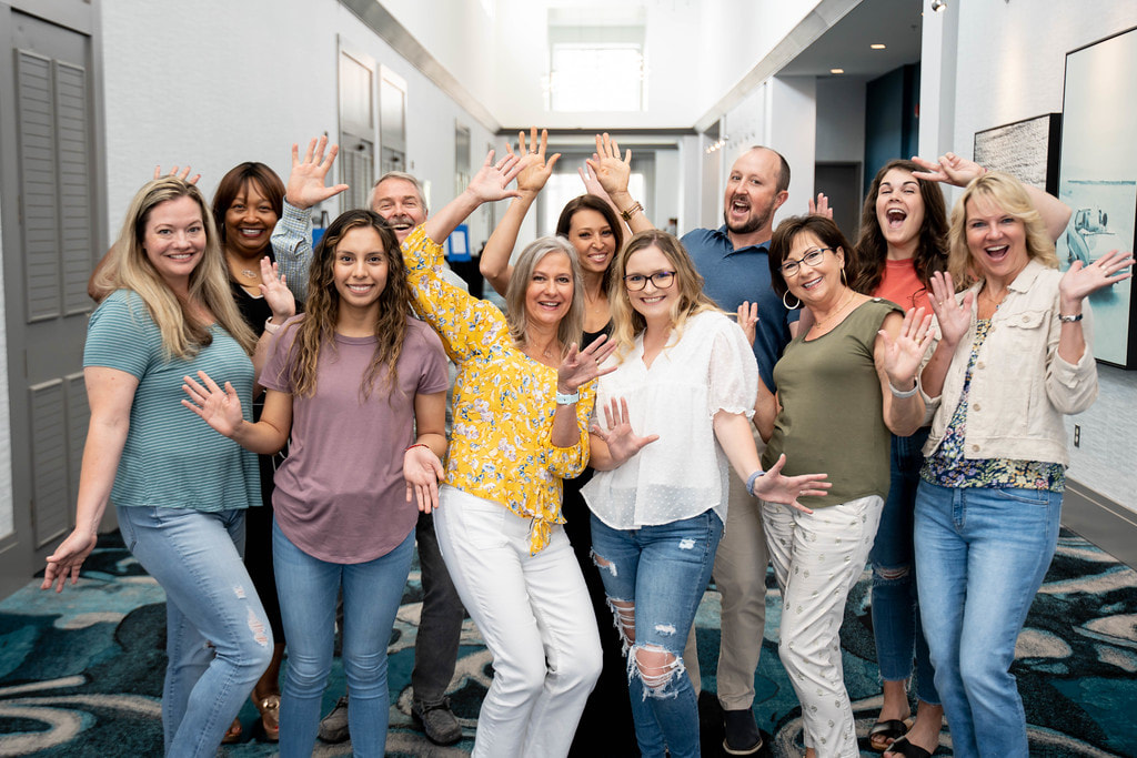 Family dentist educates family with dental technology in modern clinic